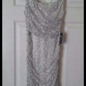 Beautiful dress. Express brand. Comes to the knee